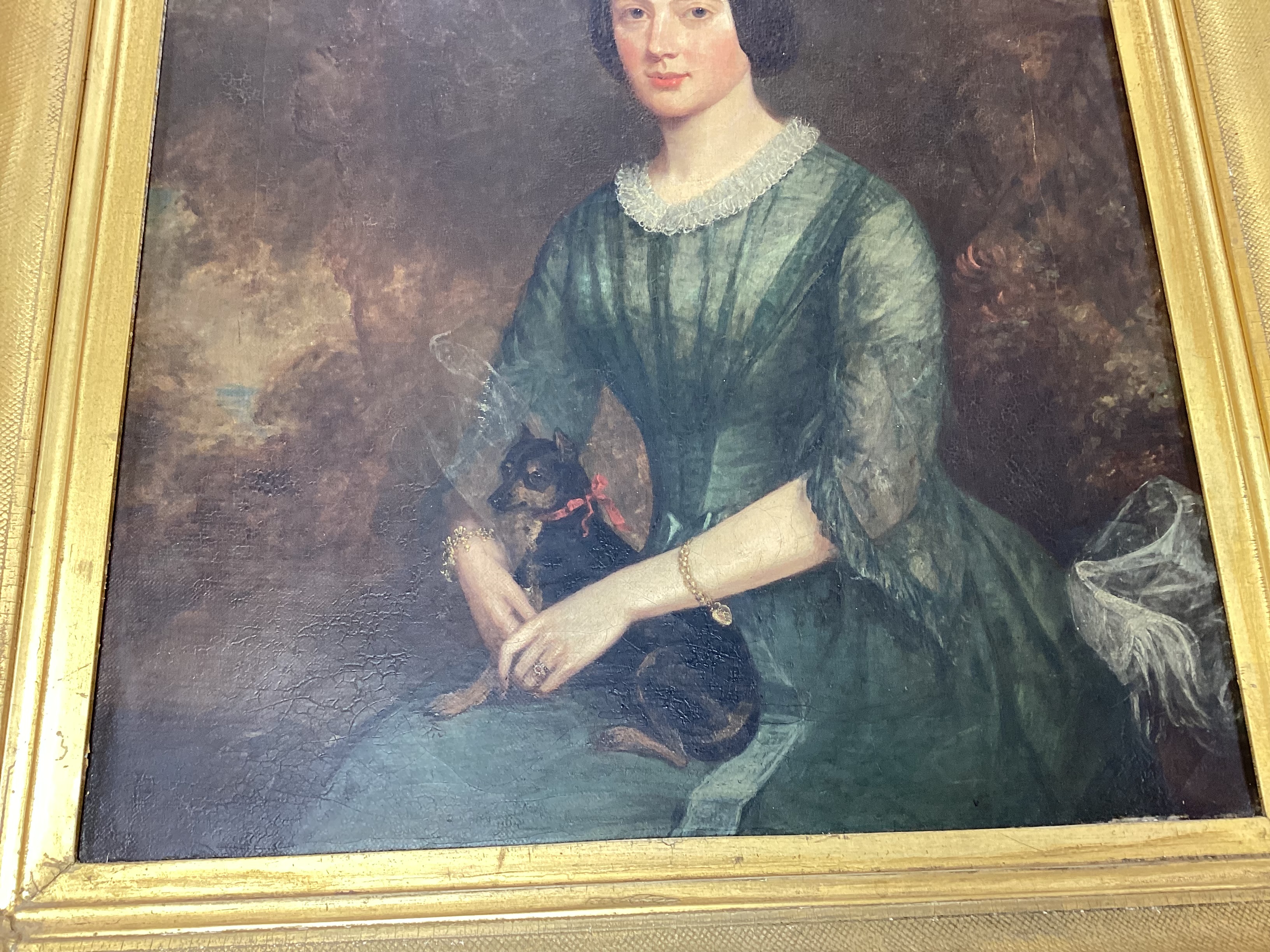 19th century English School, oil on canvas, Three quarter length portrait of a lady and her dog, 44 x 34cm, gilt framed